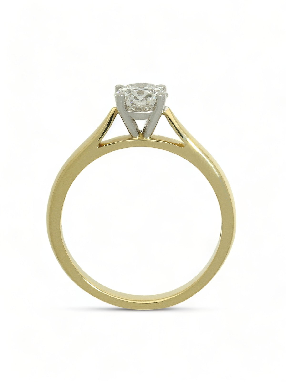 Lab grown diamond ring in a four-claw setting with a yellow gold band on a white background.