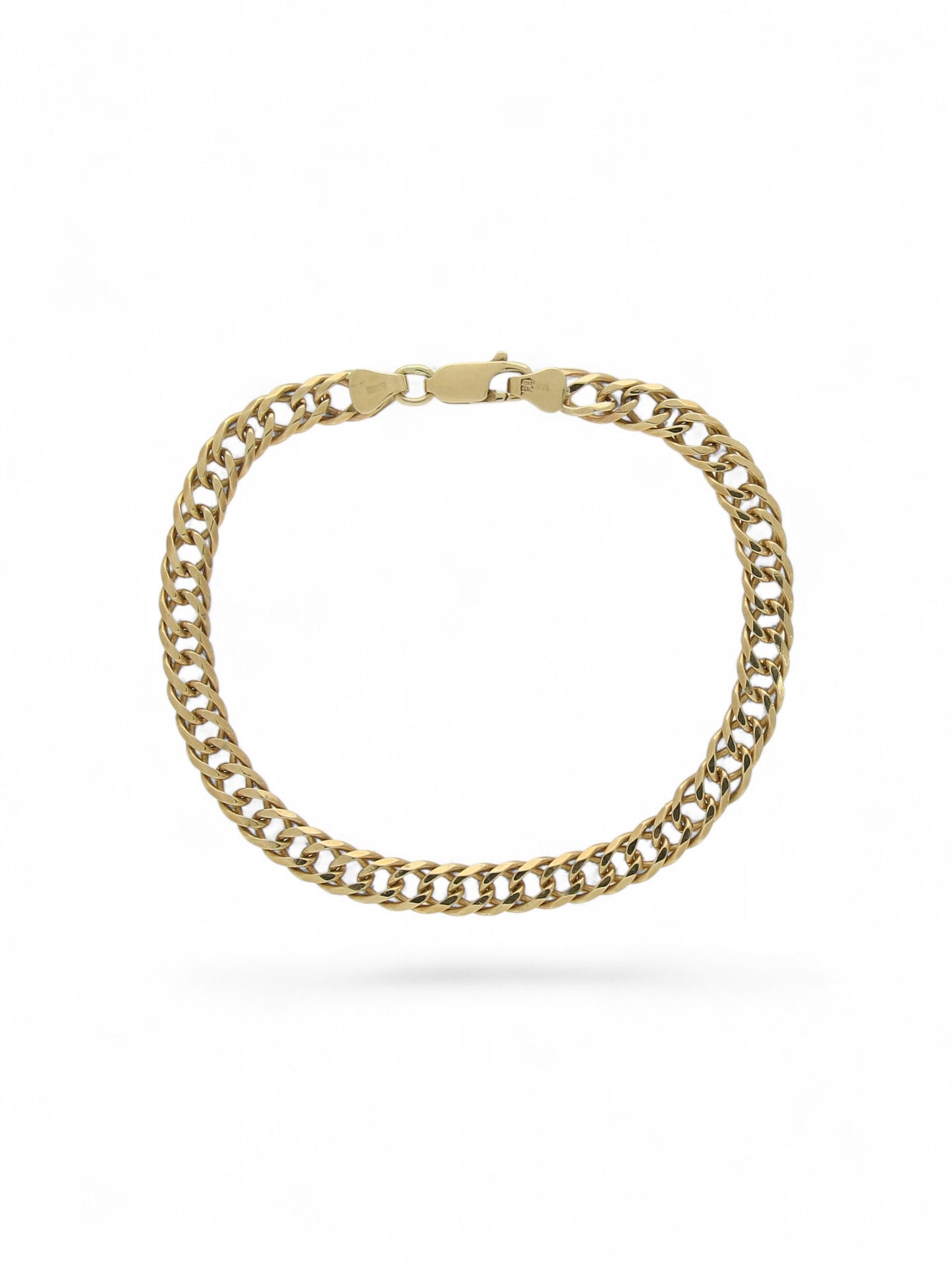 Yellow-gold double link curb bracelet with trigger clasp on a white background.
