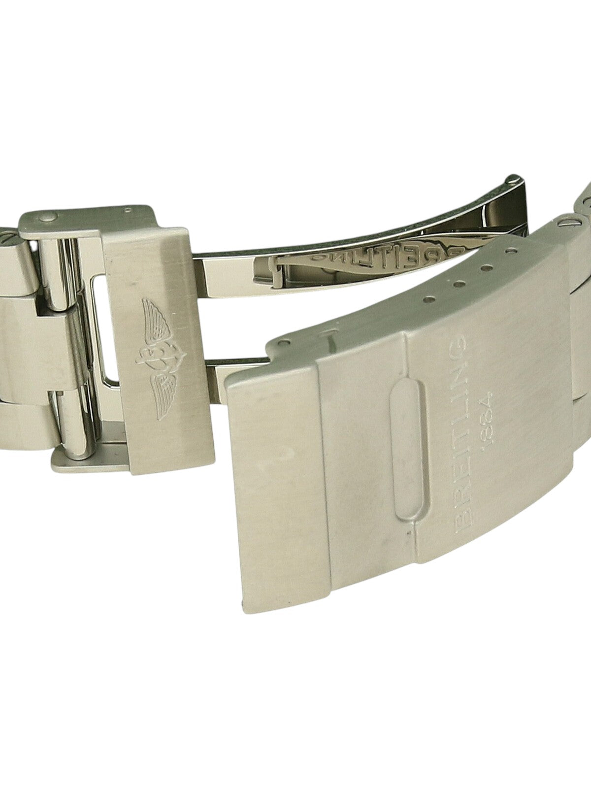 Close-up of a steel Breitling clasp on a white background.