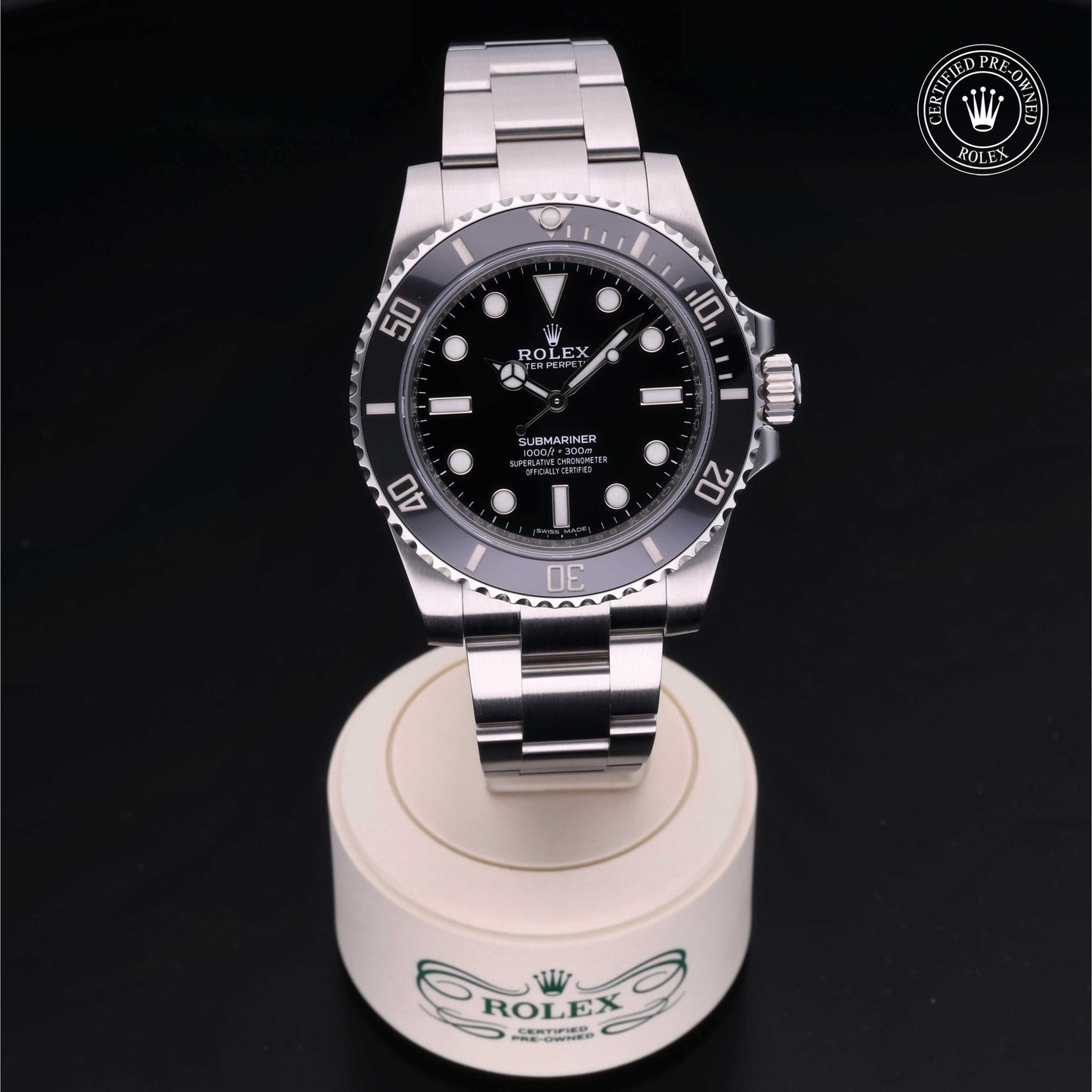 Rolex Submariner watch with steel Oyster bracelet and black dial on a white background.