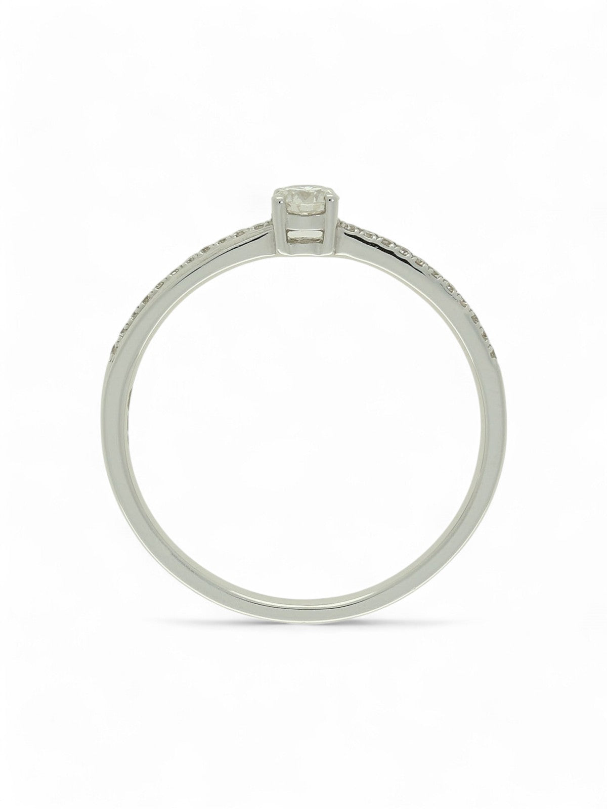 Diamond solitaire ring with round brilliant -cut centre and diamond-set shoulders in white gold on a white background.