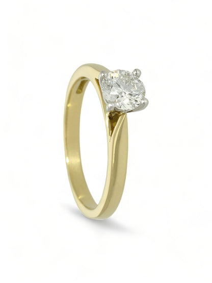 Lab grown diamond ring in a four-claw setting with a yellow gold band on a white background.