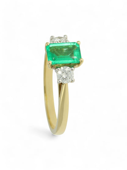 0.80ct Emerald Cut Emerald & 0.31ct Round Brilliant Cut Diamond Three Stone Ring in 18ct Yellow & White Gold