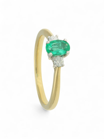 0.45ct Oval Cut Emerald & 0.13ct Round Brilliant Cut Diamond Three Stone Ring in 18ct Yellow & White Gold