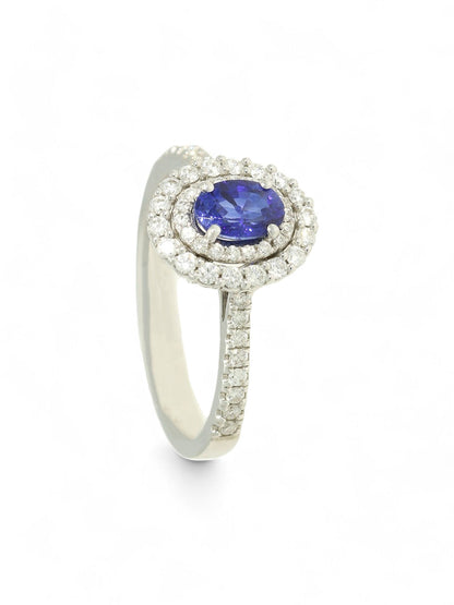 0.62ct Oval Cut Sapphire & 0.40ct Round Brilliant Cut Diamond Cluster Ring in 18ct White Gold with Diamond Shoulders