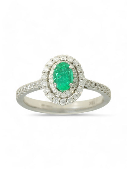 0.45ct Oval Cut Emerald & 0.40ct Round Brilliant Cut Diamond Cluster Ring in 18ct White Gold with Diamond Shoulders