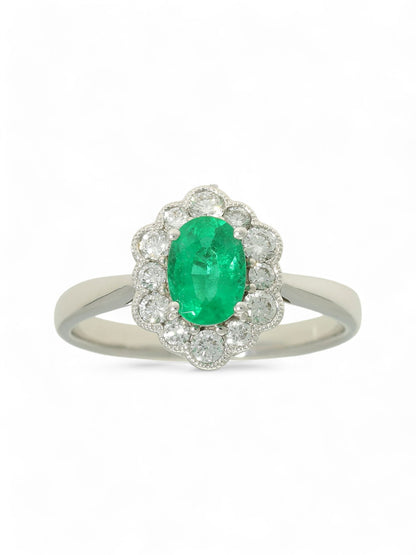 0.73ct Oval Cut Emerald & 0.40ct Round Brilliant Cut Diamond Cluster Ring Oval Cut in 18ct White Gold