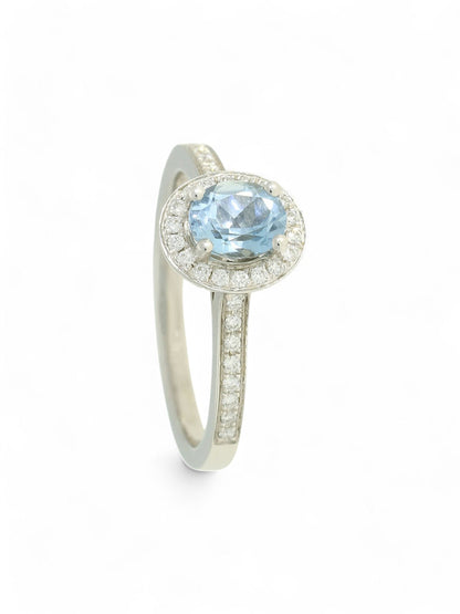 0.64ct Oval Cut Aquamarine & 0.19ct Round Brilliant Cut Diamond Cluster Ring in 18ct White Gold with Diamond Shoulders