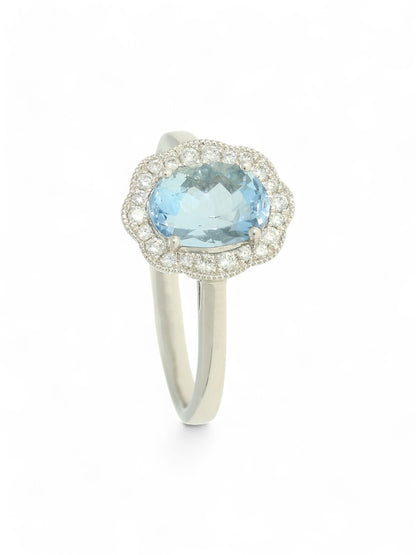 1.27ct Oval Cut Aquamarine & 0.15ct Round Brilliant Cut Diamond Cluster Ring in 18ct White Gold