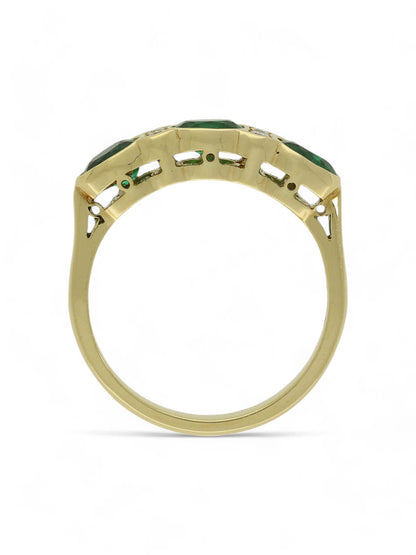 0.93ct Oval Cut Emerald & 0.08ct Round Brilliant Cut Diamond Seven Stone Ring in 18ct Yellow Gold