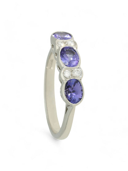 1.01ct Oval Cut Tanzanite & 0.09ct Round Brilliant Cut Diamond Seven Stone Ring in 18ct White Gold