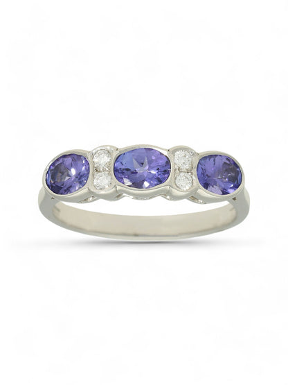 1.01ct Oval Cut Tanzanite & 0.09ct Round Brilliant Cut Diamond Seven Stone Ring in 18ct White Gold