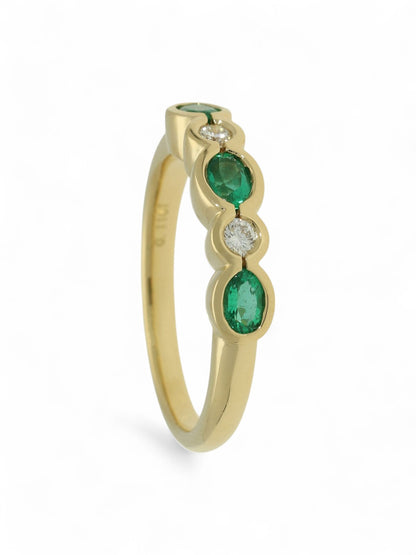 0.46ct Oval Cut Emerald & 0.11ct Round Brilliant Cut Diamond Half Eternity Ring in 18ct Yellow Gold