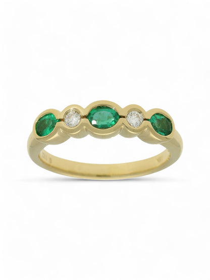 0.46ct Oval Cut Emerald & 0.11ct Round Brilliant Cut Diamond Half Eternity Ring in 18ct Yellow Gold