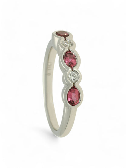 0.60ct Oval Cut Pink Tourmaline & 0.11ct Round Brilliant Cut Diamond Five Stone Ring in 9ct White Gold