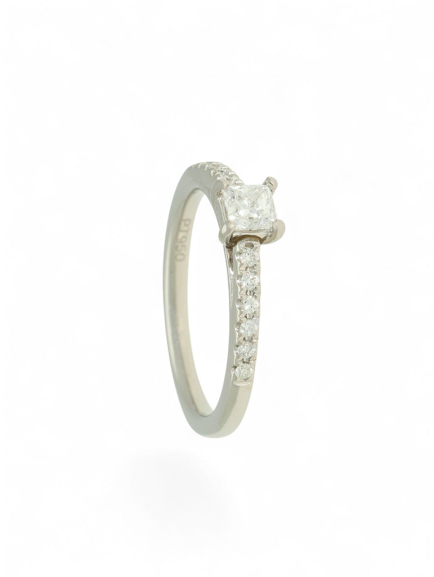 Pre-Owned diamond solitaire ring with a 0.30ct princess cut centre stone in a platinum setting with diamond set shoulders.