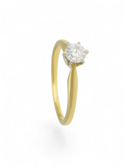 Pre-Owned diamond solitaire ring with an 18ct yellow gold shank, 6 18ct white gold claws, and a 0.33ct round brilliant cut diamond centre stone.