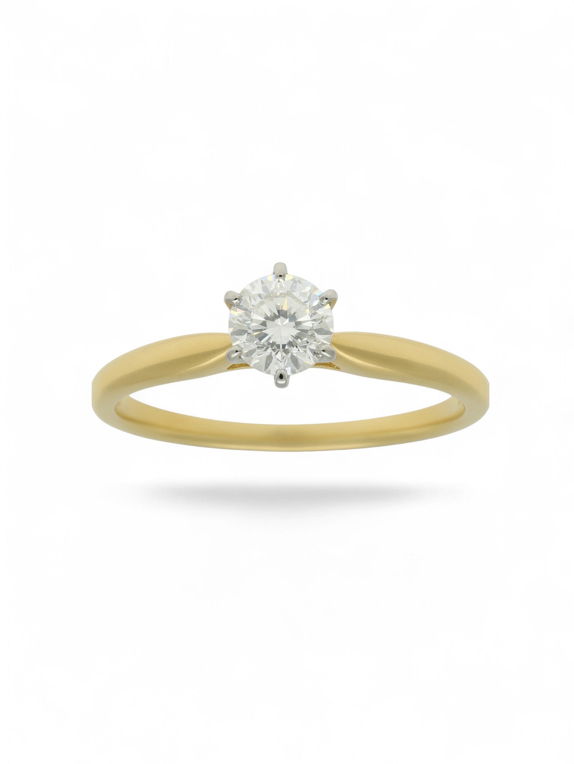 Pre-Owned diamond solitaire ring with an 18ct yellow gold shank, 6 18ct white gold claws, and a 0.33ct round brilliant cut diamond centre stone.