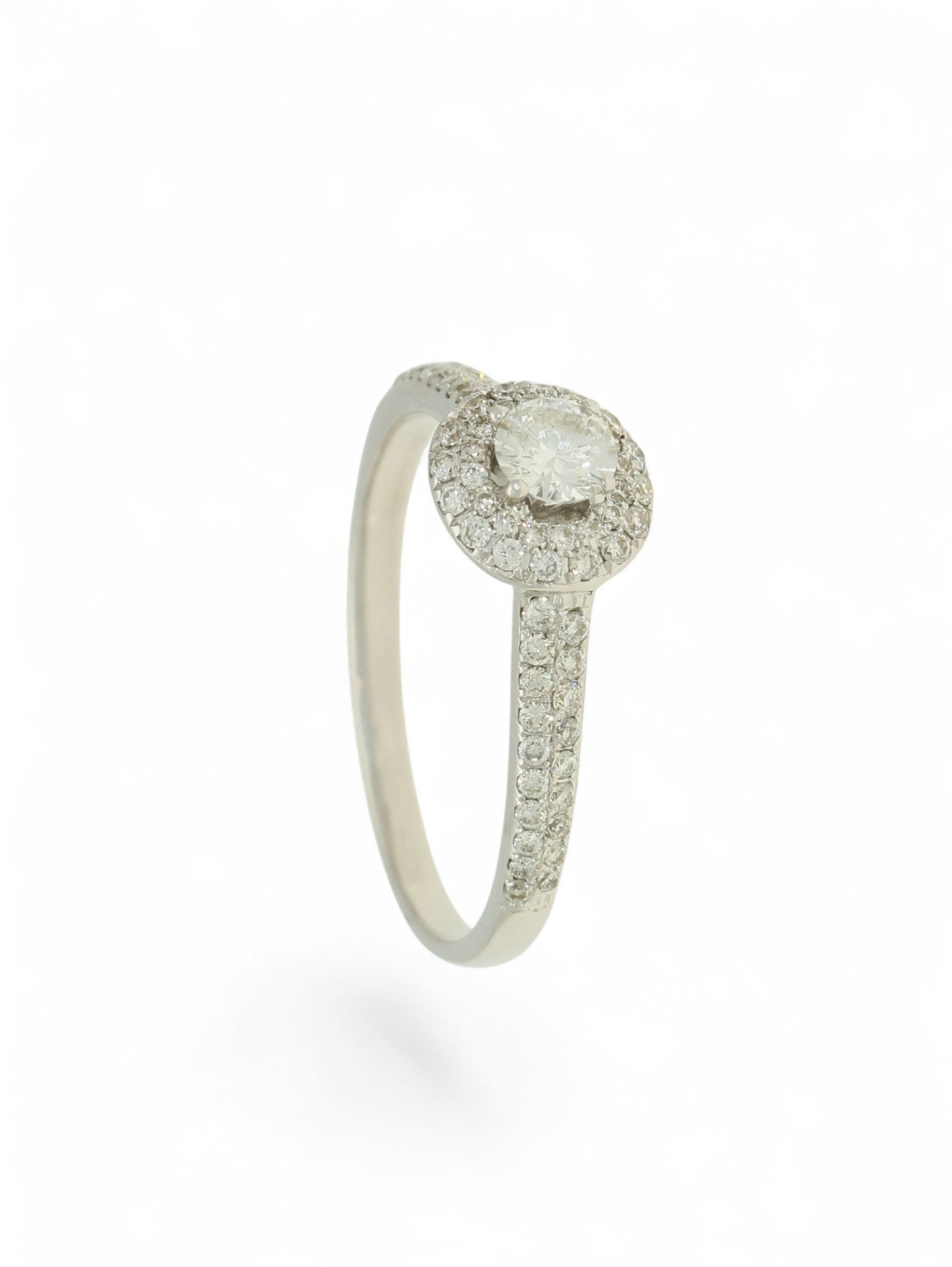 Pre-Owned 9ct white gold diamond halo ring with a 0.25ct centre stone, diamond halo, and diamond set shoulders.