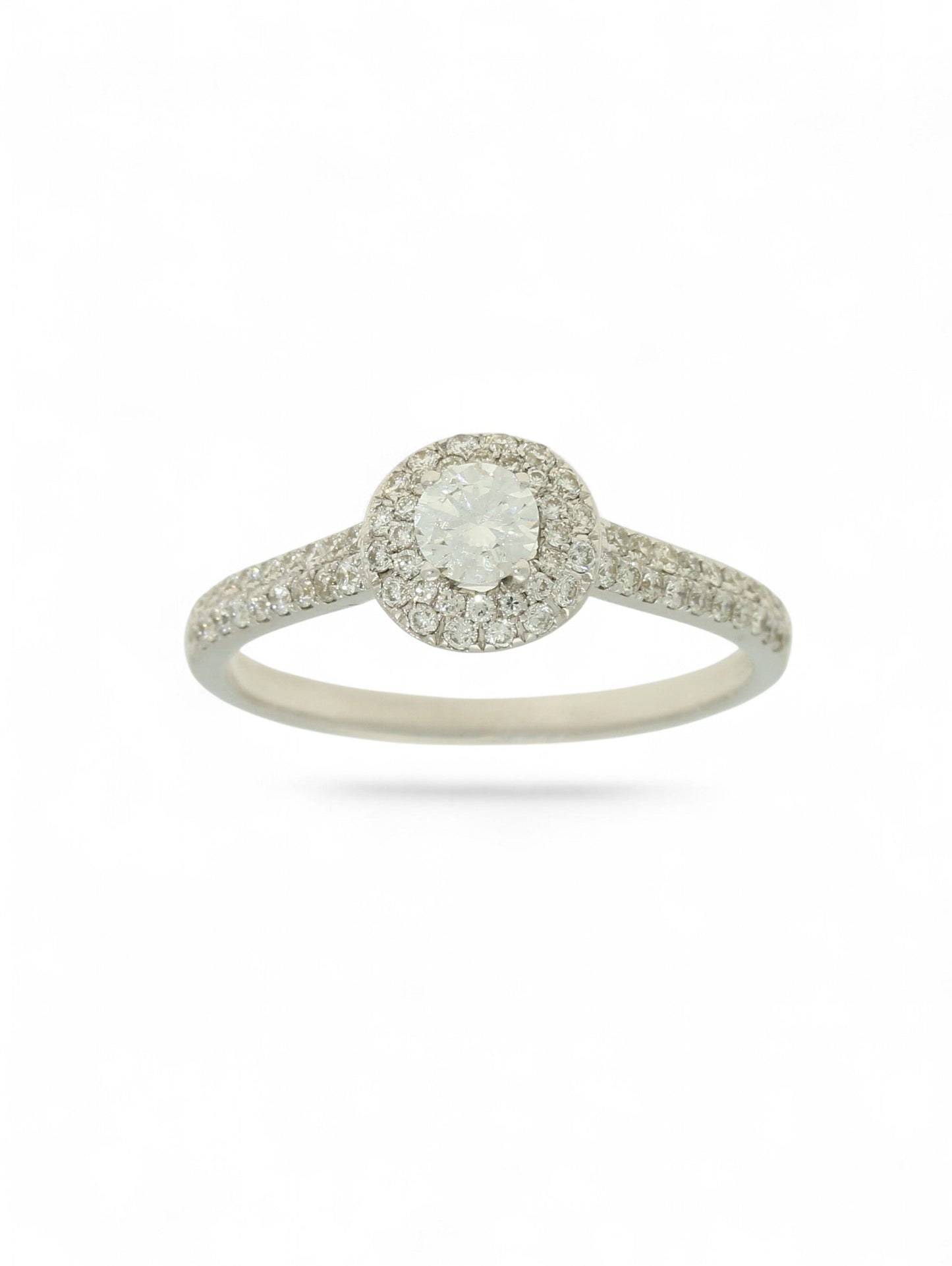 Pre-Owned 9ct white gold diamond halo ring with a 0.25ct centre stone, diamond halo, and diamond set shoulders.