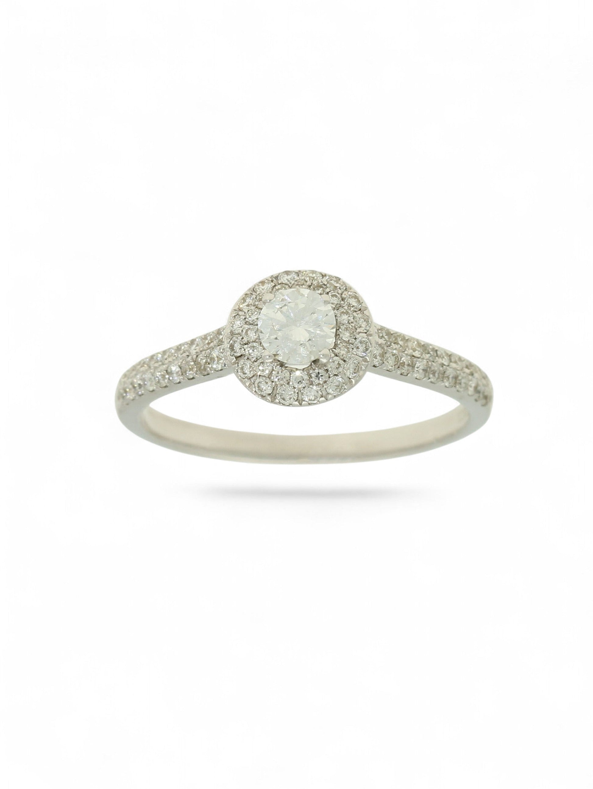 Pre-Owned 9ct white gold diamond halo ring with a 0.25ct centre stone, diamond halo, and diamond set shoulders.