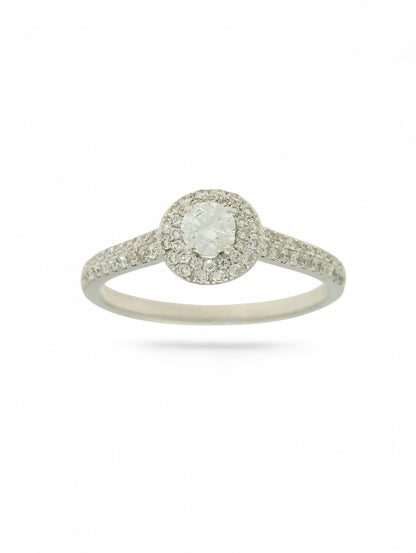 Pre-Owned 9ct white gold diamond halo ring with a 0.25ct centre stone, diamond halo, and diamond set shoulders.