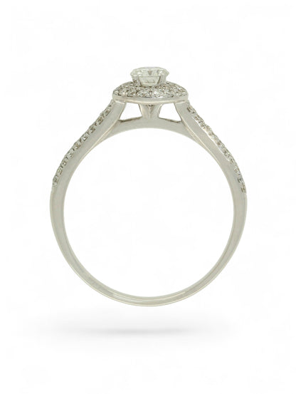 Pre-Owned 9ct white gold diamond halo ring with a 0.25ct centre stone, diamond halo, and diamond set shoulders.