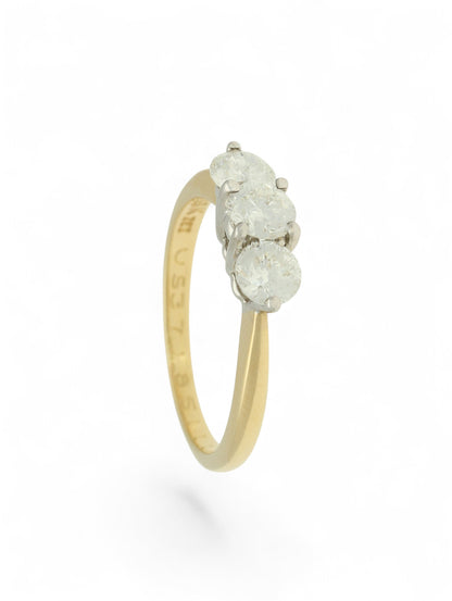 Pre-Owned ring with three round brilliant cut diamonds set in white gold and mounted on a stamped 18ct yellow gold shank.