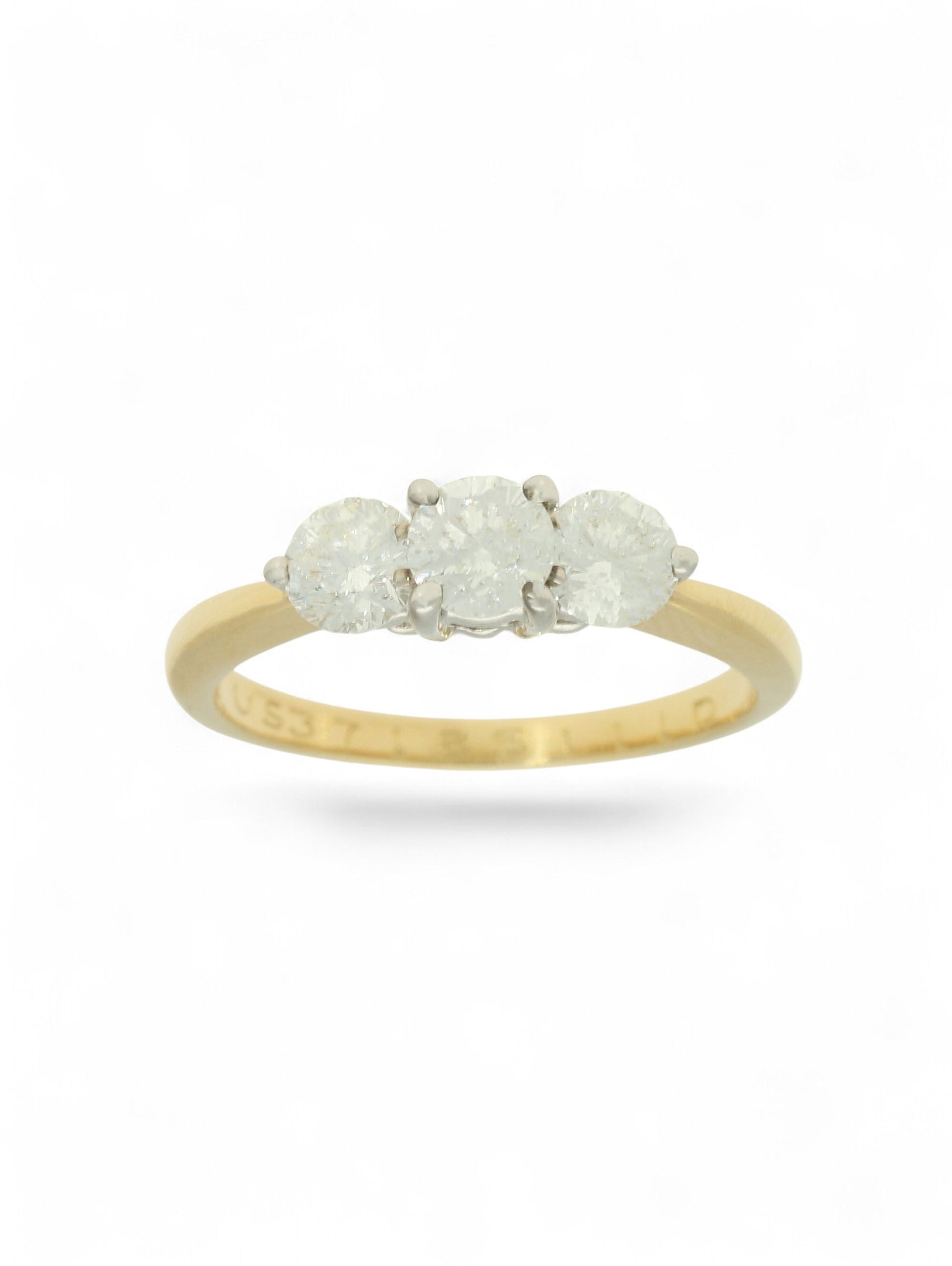 Pre-Owned ring with three round brilliant cut diamonds set in white gold and mounted on a stamped 18ct yellow gold shank.