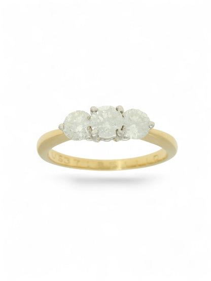 Pre-Owned ring with three round brilliant cut diamonds set in white gold and mounted on a stamped 18ct yellow gold shank.