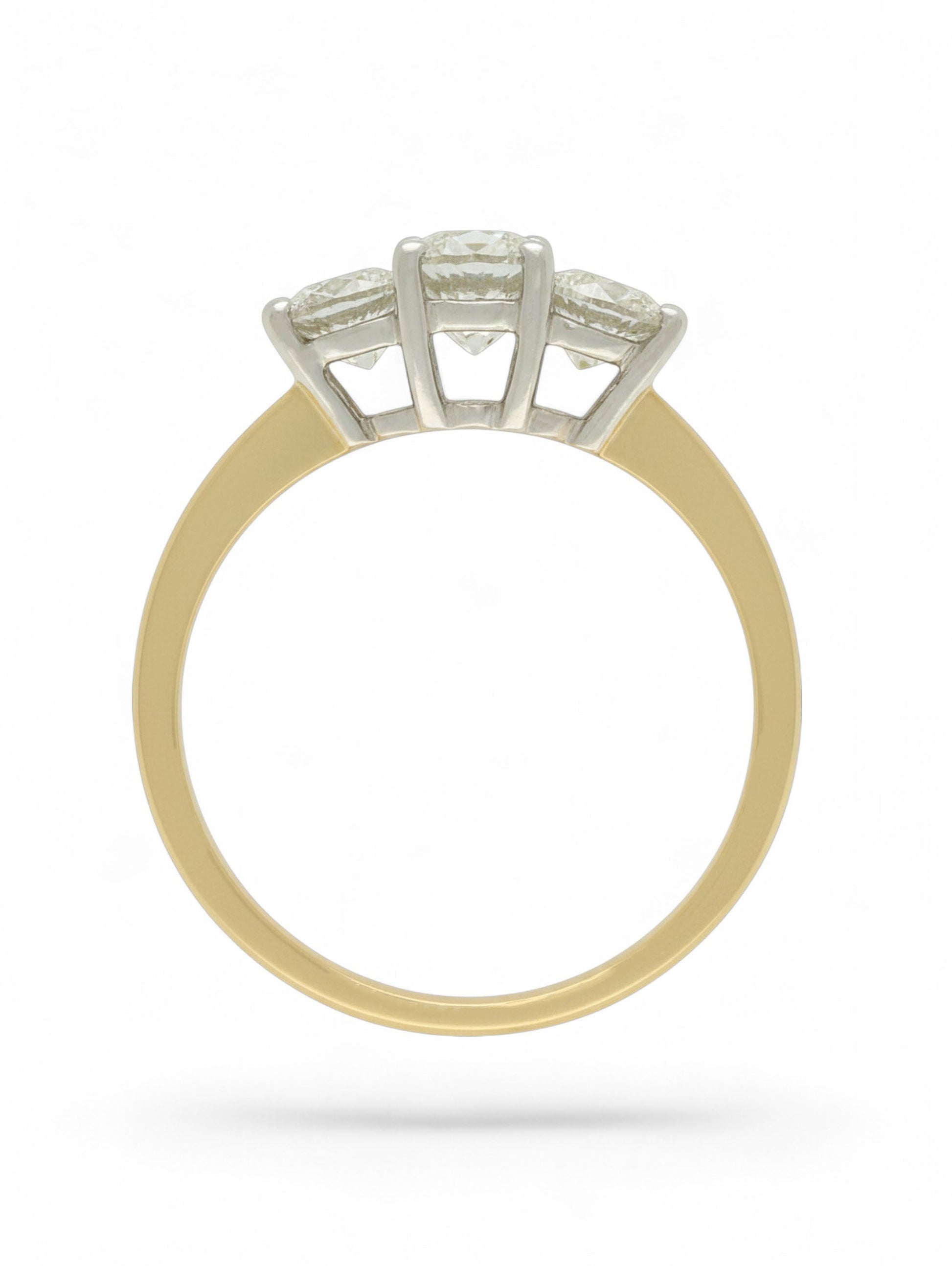 Pre-Owned ring with three round brilliant cut diamonds set in white gold and mounted on a stamped 18ct yellow gold shank.