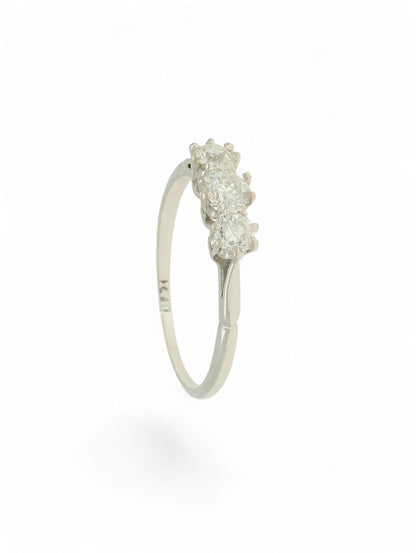 White metal diamond three-stone ring on a white background.