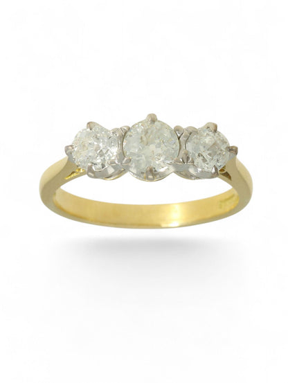 18ct yellow and white gold diamond three-stone ring on a white background.