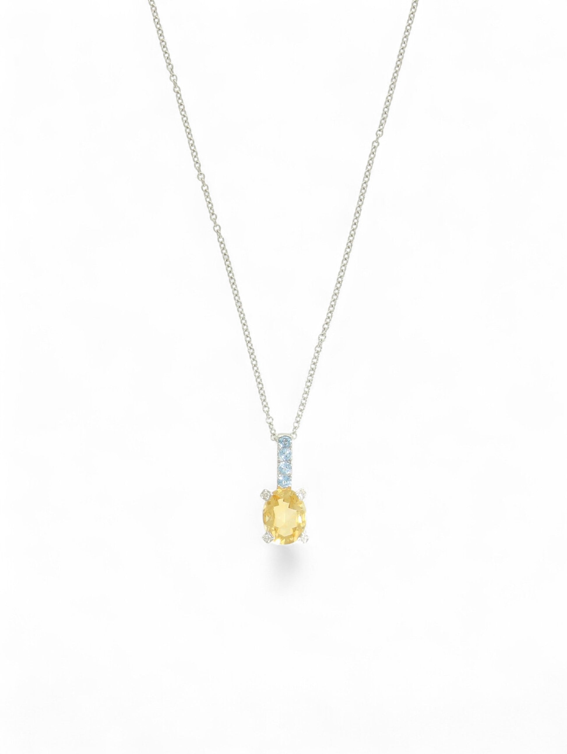 Citrine, aquamarine and diamond pendant with a white-gold chain on a white background.