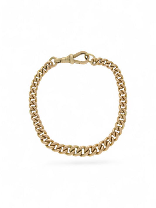 Yellow-gold graduated curb chain bracelet with swivel clasp on a white background.