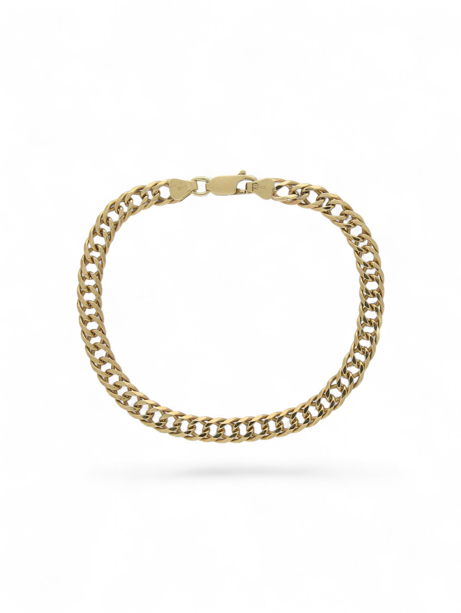 Yellow-gold double link curb bracelet with trigger clasp on a white background.