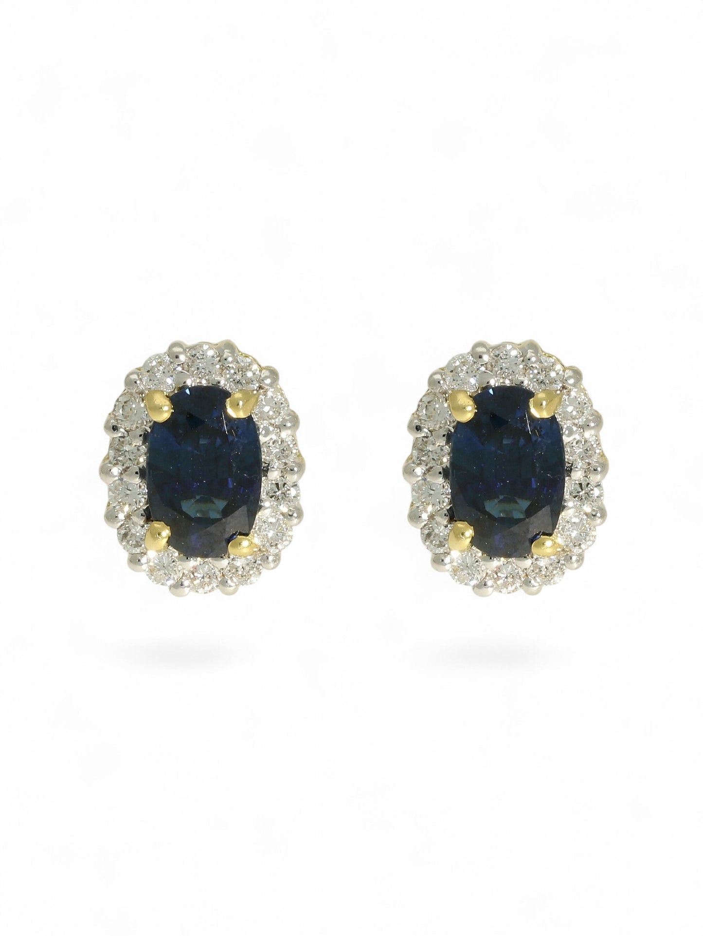 Sapphire & diamond cluster earrings on a white background.