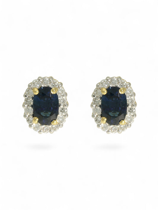 Sapphire & diamond cluster earrings on a white background.