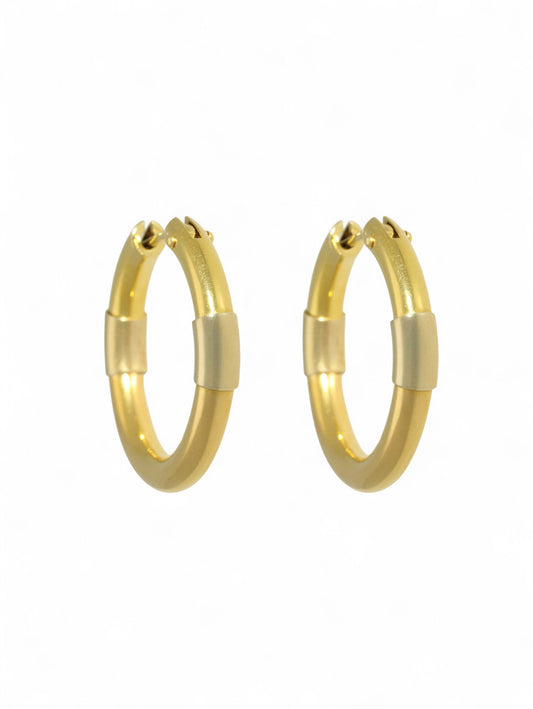 Yellow-gold hoop earrings with post and clip fitting on a white background.