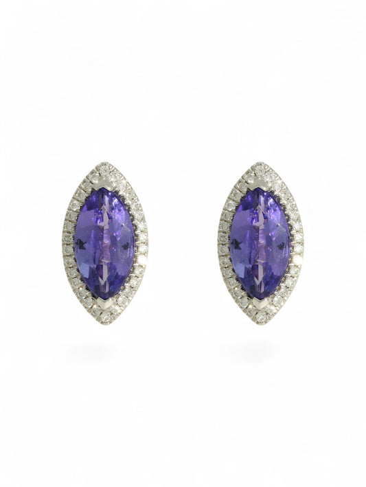 Tanzanite & diamond marquise cluster earrings on a white background.