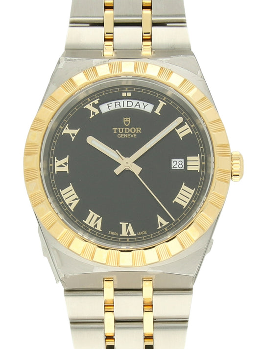 TUDOR Royal watch with steel and yellow-gold bracelet and black dial on a white background.