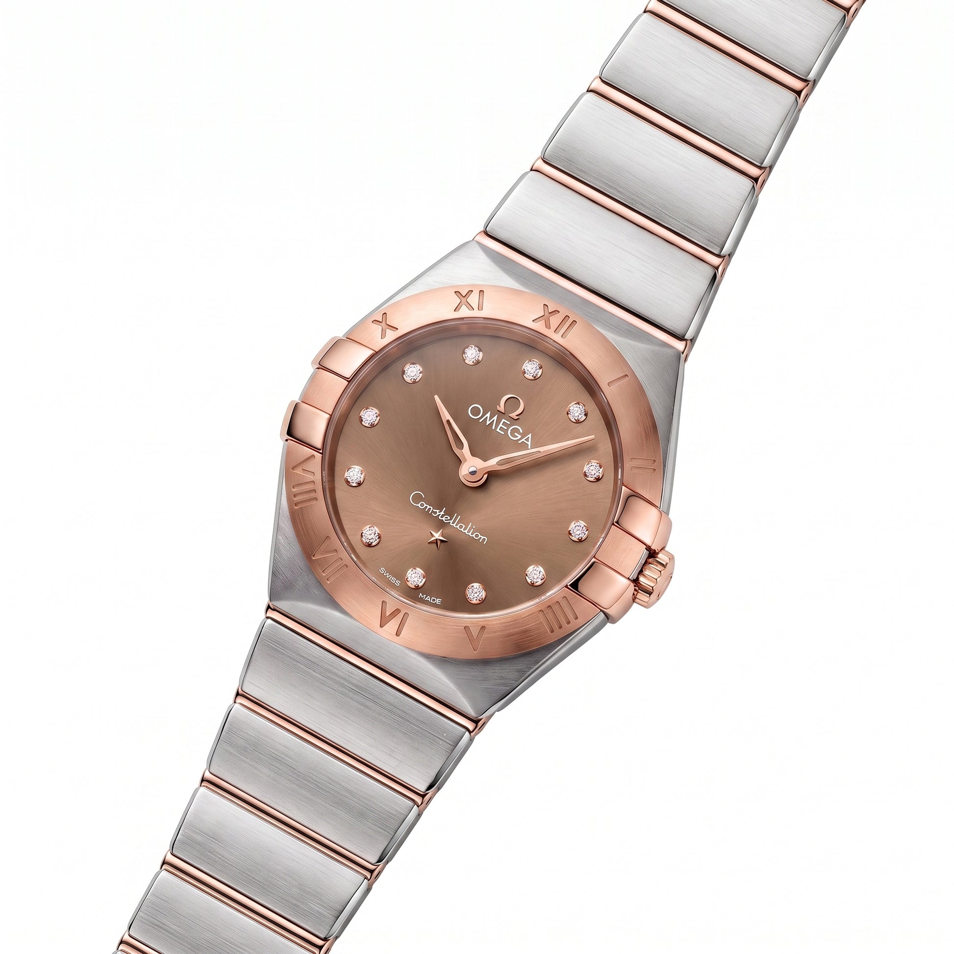 Omega Constellation Manhattan with 25mm case, steel and 18ct rose gold bracelet and chocolate, diamond-set dial on a white background.