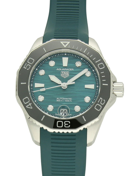 TAG Heuer Aquaracer watch with a green rubber strap and green dial on a white background.
