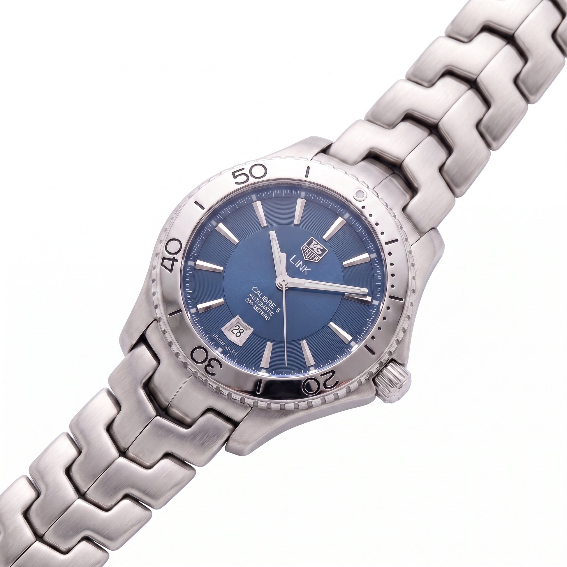 TAG Heuer Link with 42mm steel case, steel bracelet and blue dial on a white background.