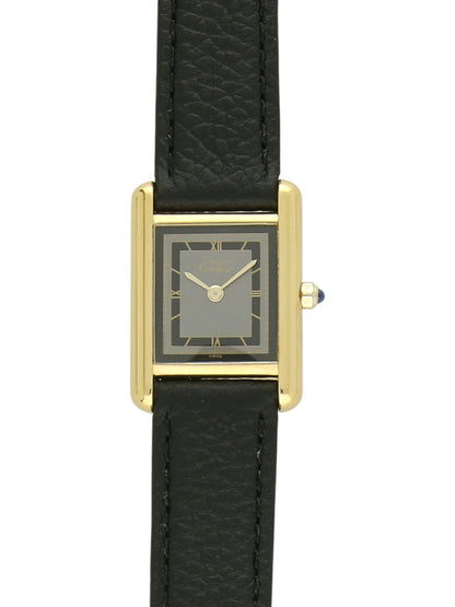 Yellow gold Cartier watch with a black leather strap and grey dial on a white background.