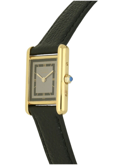 Yellow gold Cartier watch with a black leather strap and grey dial on a white background.