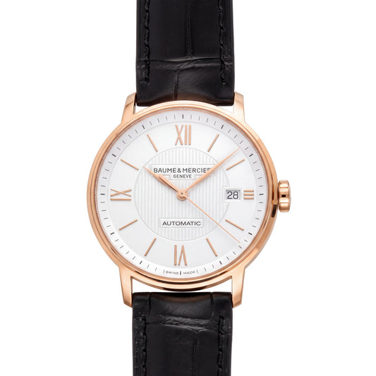 Baume & Mercier Classima with 39mm 18ct rose gold case, black leather strap and silver dial on a white background.