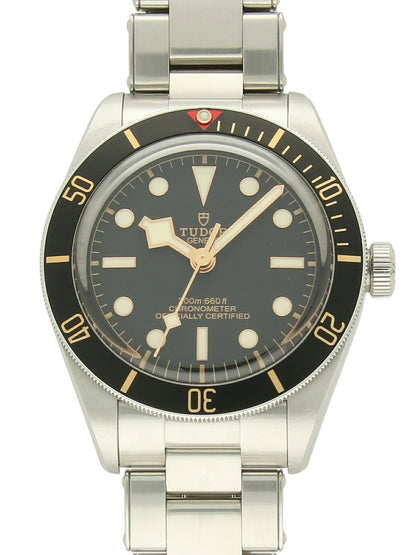 TUDOR Black Bay 58 with steel case, steel bracelet and black dial on a white background.
