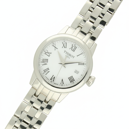 Tissot Classic Dream with steel bracelet and white dial on a white background.