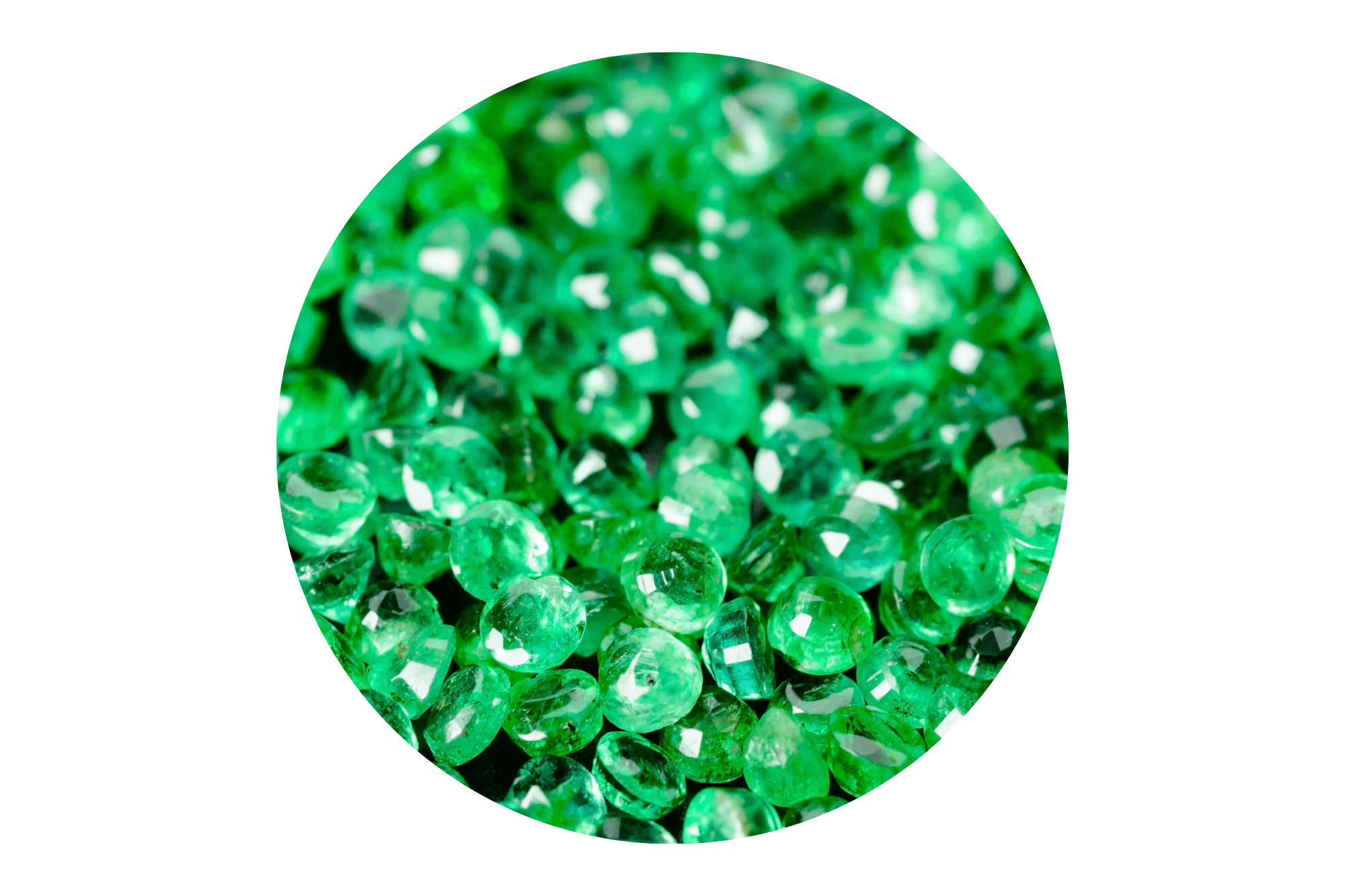 Close-up of green emerald gemstones on a white background.
